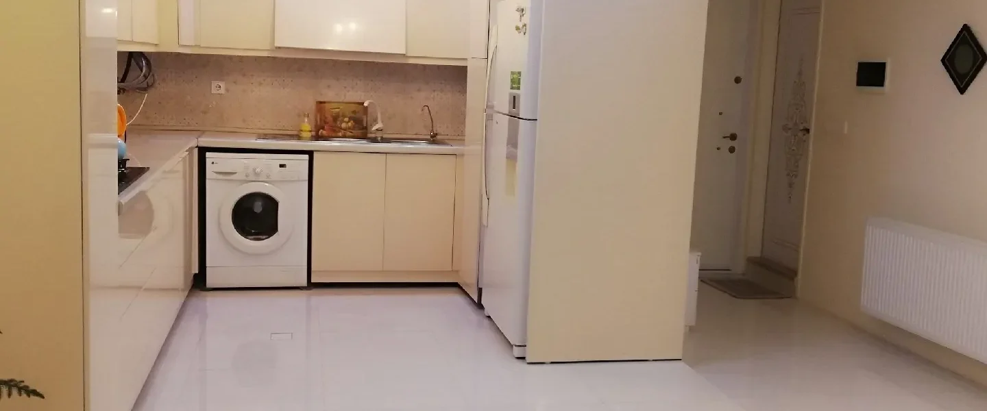آشپزخانه با لباسشویی و یخچال آپارتمان در بابلسر 415846
